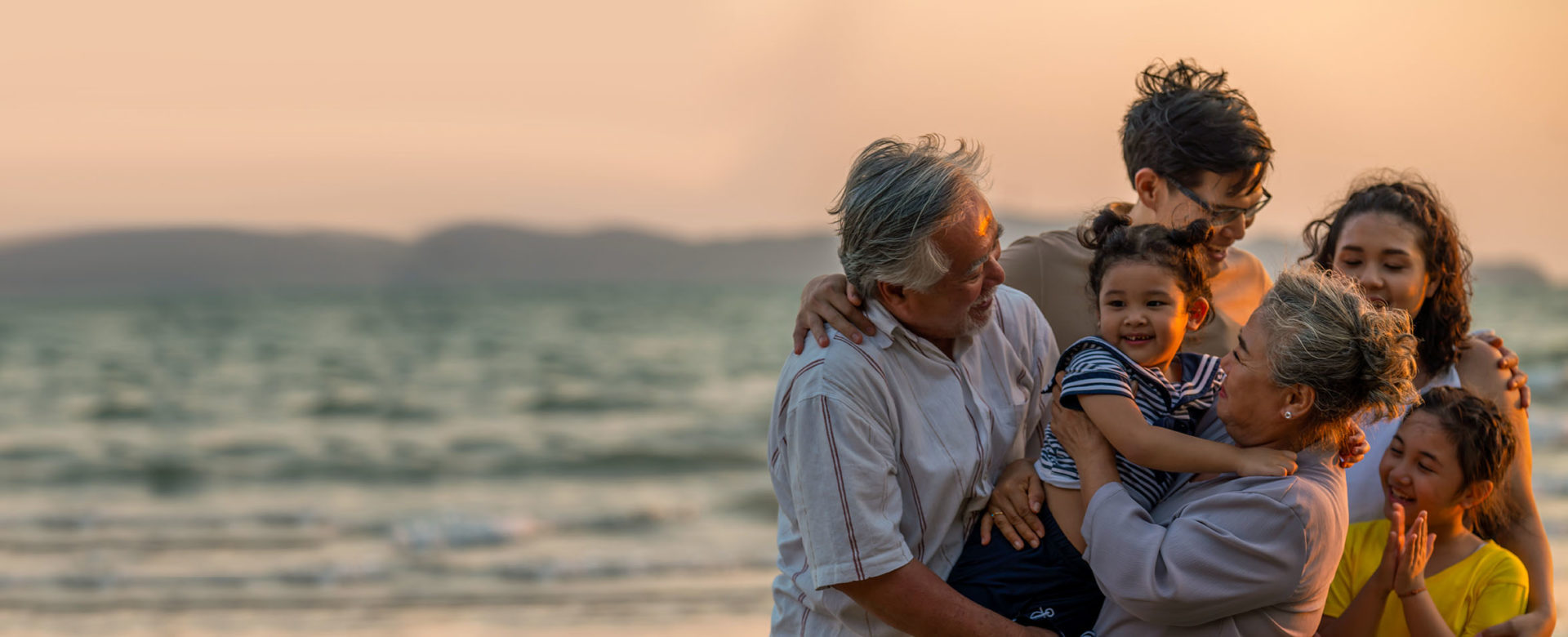 Intergenerational family on beach